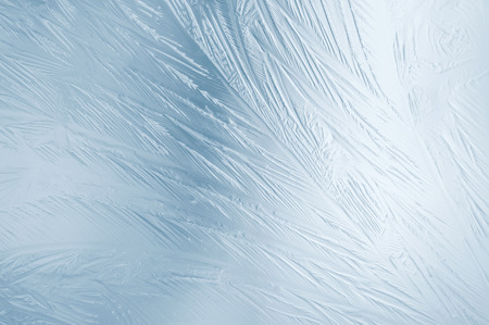 Frozen glass. Abstract winter ice pattern on frozen window.の写真素材