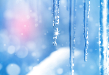 Background of bright transparent icicles in the sunlightの写真素材