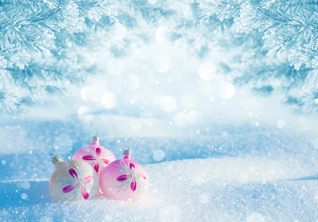Winter landscape. Winter festive background with snow-covered pine branches and Christmas ballsの写真素材