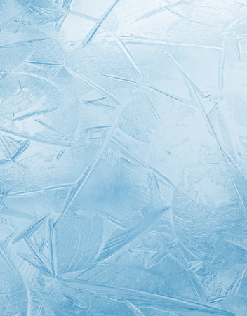 Natural bright background of the first ice on the water surfaceの写真素材
