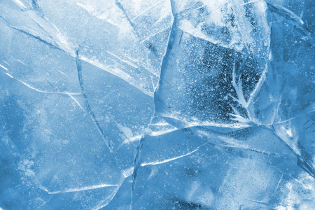 Abstract ice background. Blue background with cracks on the ice surfaceの写真素材