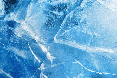 Abstract ice background. Blue background with cracks on the ice surfaceの写真素材