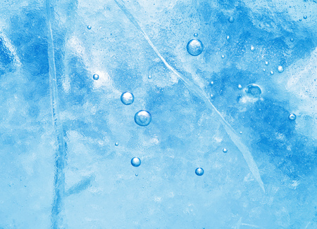Abstract ice background. Blue background with cracks on the ice surfaceの写真素材