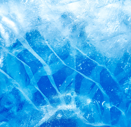 Abstract ice background. Blue background with cracks on the ice surfaceの写真素材