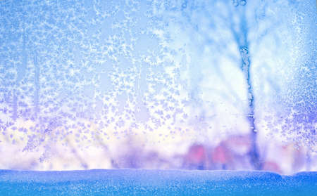 Frozen glass. Winter ice pattern on frozen window.の写真素材