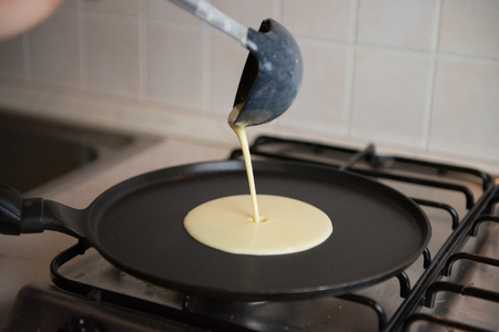 Making fresh homemade thin crepes pancakesの写真素材