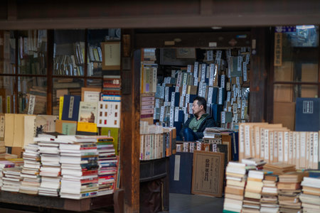 Kyoto, Japan - November 8 2018: Portrait of a bookshop owner in Teramachi Street, Kyoto, Japan