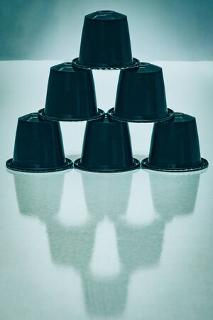 view of some aromatic, tasty espresso coffee capsules in a triangle formationのeditorial素材