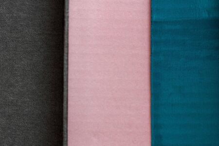 pink, blue and dark gray background showing different textures made with cartonsの写真素材
