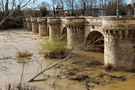 medieval stone bridge, puente mayor, crossing rio carrion, palencia, spainの写真素材
