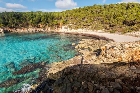 escorxada beach, abandoned paradise beaches during spring and summer in Menorca, a Spanish Mediterranean island, after the covid 19 coronavirus crisisの写真素材