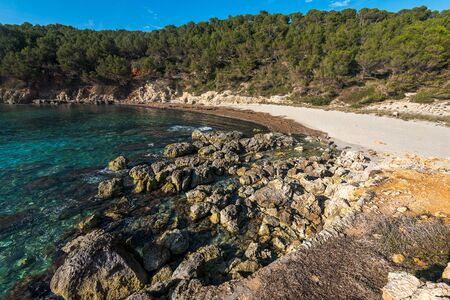 escorxada beach, abandoned paradise beaches during spring and summer in Menorca, a Spanish Mediterranean island, after the covid 19 coronavirus crisisの写真素材