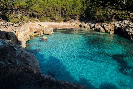 fustam beach, abandoned paradise beach during spring and summer in Menorca, a Spanish Mediterranean island, after the covid 19 coronavirus crisisの写真素材