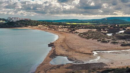 tirant beach, abandoned paradise beach during spring and summer in Menorca, a Spanish Mediterranean island, after the covid 19 coronavirus crisisの写真素材