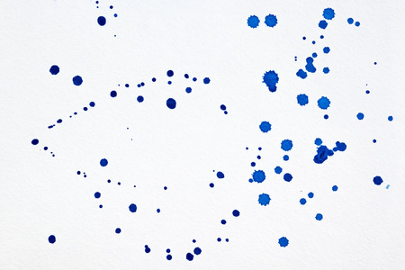 Abstract blue watercolor hand paint texture on white background. Drop the blue watercolors on white paper.の写真素材