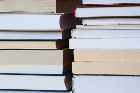 Stacks of books on wooden turquoise background. Free place for text. Education conceptの写真素材