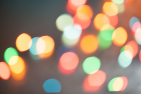 Abstract blurred background. Colorful shimmering Christmas lights bokeh of electric garlands. New Year bokeh background.の写真素材