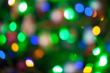 Abstract blurred background. Colorful shimmering Christmas lights bokeh of electric garlands. New Year bokeh background.の写真素材