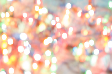 Abstract blurred background. Colorful shimmering Christmas lights bokeh of electric garlands. New Year bokeh background.の写真素材