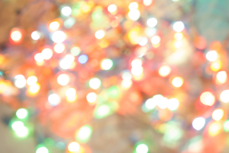 Abstract blurred background. Colorful shimmering Christmas lights bokeh of electric garlands. New Year bokeh background.の写真素材