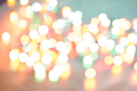 Abstract blurred background. Colorful shimmering Christmas lights bokeh of electric garlands. New...
