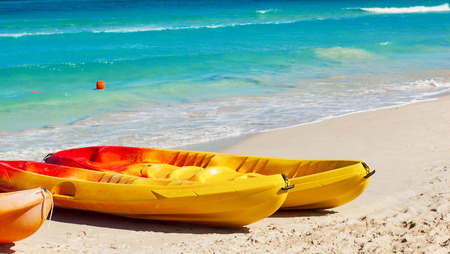 kayaks on the tropical beach with blue Atlantic sea in background. Cuba, Varaderoの写真素材