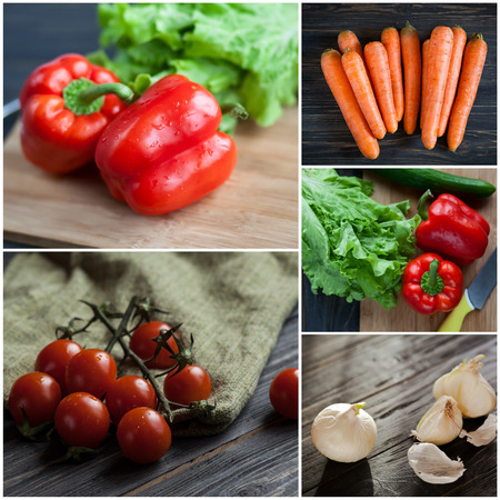 Collection of fresh ripe vegetables. Tomatoes, carrot,  onion and red pepper with salad on dark wooden tableの写真素材