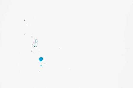 Abstract blue watercolor hand paint texture on white background. Drop the blue watercolors on white paper.の写真素材