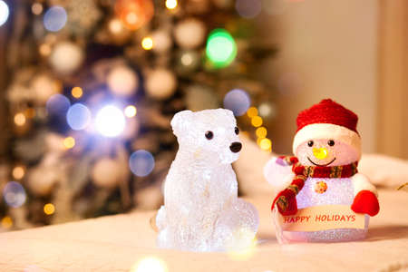 Holiday concept. Christmas tree with garland bokeh and christmas toysの写真素材