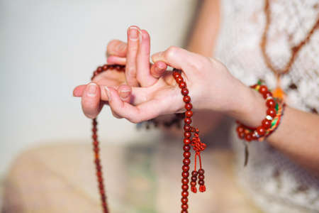 Calm woman meditating. The girl is dressed in ethnic clothes. natural materials. Zen conception. Health mental conceptionの写真素材