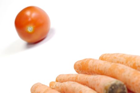 Tomato and carrots on white background. Look tasty and freshの写真素材