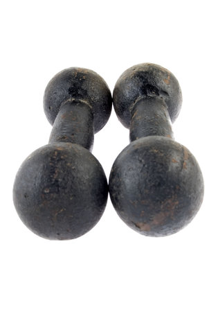 Two rusty black dumbbells on white backgroundの写真素材