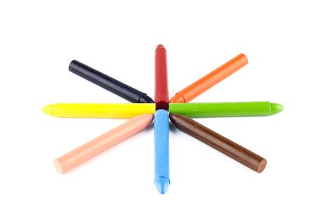 Wax crayons lined up against a white background. Art and craft background.の写真素材