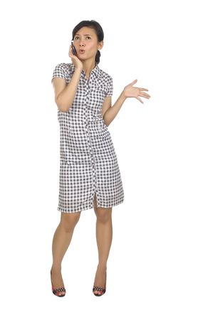 Woman Have Call on Her Cellphone and look happy. Posing in fullbody, isolated on white backgroundの写真素材
