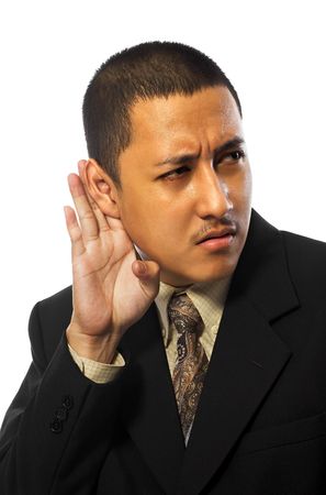 Young business man listening something isolated on white backgroundの写真素材