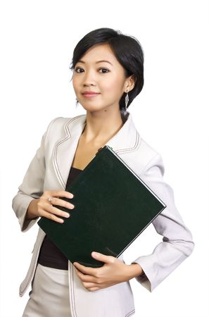 Beautiful business woman holding book in her hand. She looks happy and intelligentの写真素材