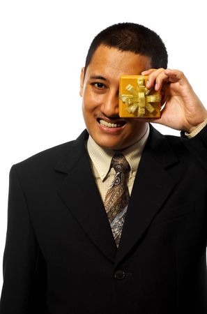 Business man giving a gift isolated on white backgroundの写真素材