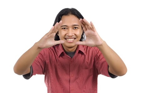 Handsome long hair man framing his face isolated on white backgroundの写真素材