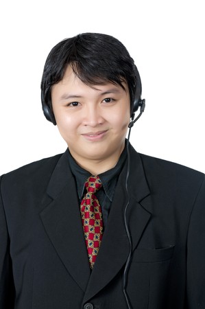 Asian phone operator wearing suit isolated over white backgroundの写真素材