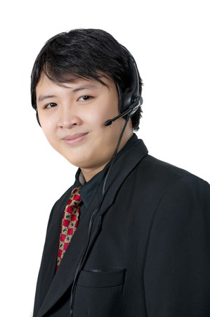 Asian phone operator wearing suit isolated over white backgroundの写真素材
