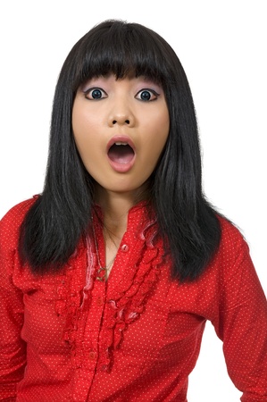 Asian woman surprised wearing red shirt and isolated over white backgroundの写真素材