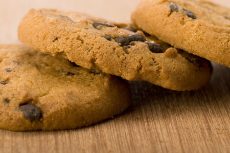 Chocolate chips cookies on wooden background