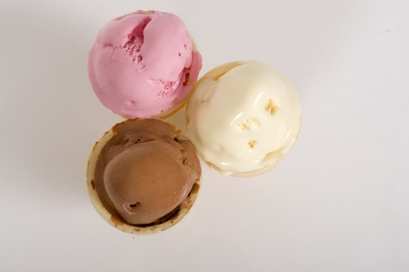 Three scoops of ice creams on white backgroundの写真素材