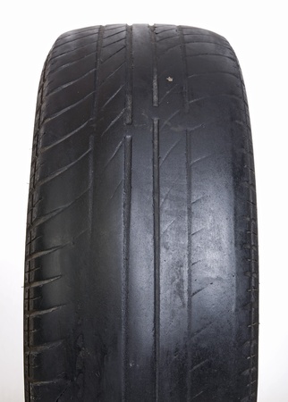 Old tires stacked, isolated on white background の写真素材