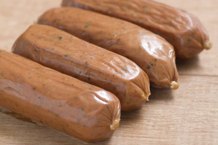 Four sausage shot with macro lens on wooden background