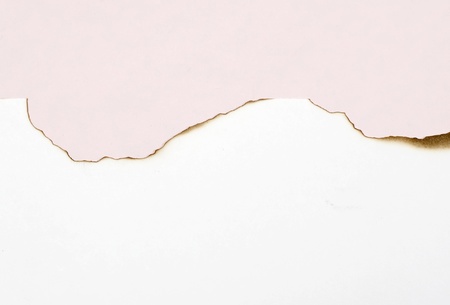 Burned white paper and red paper as background  You can write your message in the paperの写真素材