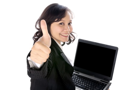 Woman happy giving thumbs up with excited expression. She using laptop pc isolated over white backgroundの写真素材