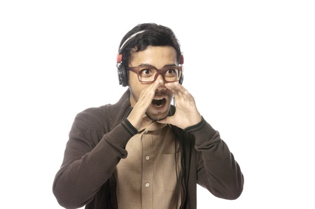 Handsome young man shout his mouth isolated over white backgroundの写真素材