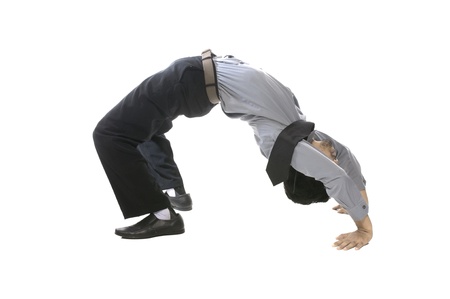 Young business man do acrobatic position isolated over white backgroundの写真素材