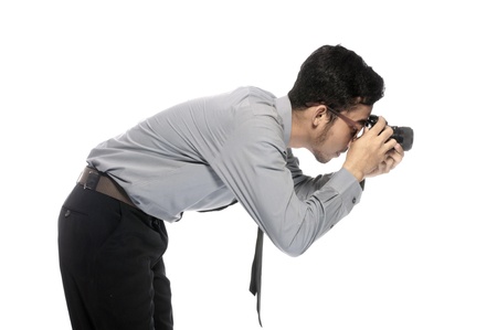 Young photographer take picture using analog SLR Cameraの写真素材
